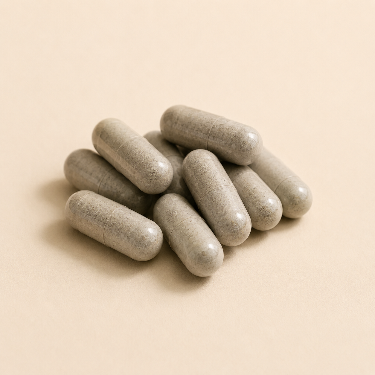 A pile of grey capsules