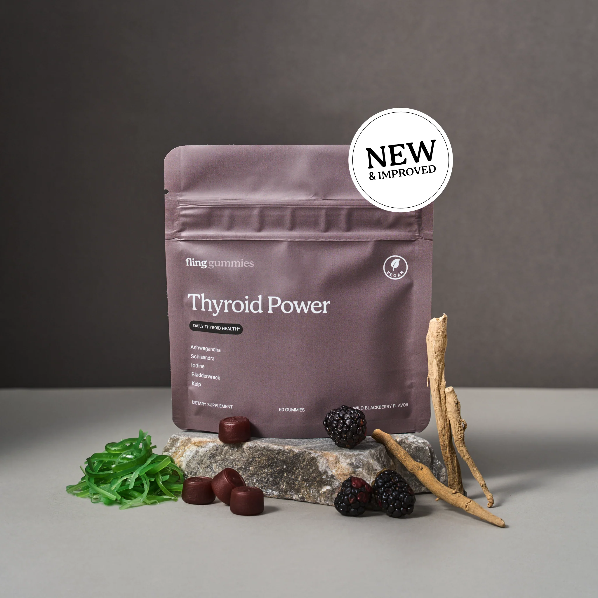 Thyroid Power pouch, New and Improved, on a plinth with kelp and blackberries